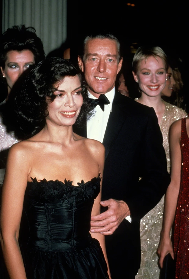 Halston (1932 - 1990) with Bianca Jagger at the Metropolitan Museum of Art's Costume Institute Gala, New York City, 7th December 1981